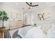 Bright bedroom with modern decor, a ceiling fan, and a stylish rug and dresser at 135 48Th Ave, St Petersburg, FL 33703