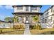 Charming two-story home with a manicured lawn and inviting front porch at 135 48Th Ave, St Petersburg, FL 33703