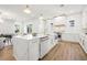 Modern kitchen with a large island, custom cabinets, and high-end appliances seamlessly connected to the living area at 135 48Th Ave, St Petersburg, FL 33703