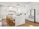 Bright, open kitchen featuring a large marble island, white cabinets, and modern appliances at 135 48Th Ave, St Petersburg, FL 33703