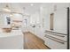 Well-lit kitchen with white cabinets, a center island, stainless steel appliances, and modern accents at 135 48Th Ave, St Petersburg, FL 33703