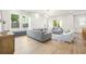 Bright, modern living room with a white marble fireplace and comfortable seating at 135 48Th Ave, St Petersburg, FL 33703