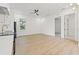 Open-concept living space with hardwood floors and modern fixtures near kitchen at 135 48Th Ave, St Petersburg, FL 33703