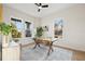 Bright home office with a wood desk, area rug, plenty of natural light, and neutral decor at 135 48Th Ave, St Petersburg, FL 33703