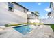 Backyard pool with nearby lounge chairs and outdoor living area for relaxing and fun at 135 48Th Ave, St Petersburg, FL 33703