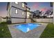 Beautiful backyard with a sparkling pool and a well-maintained lawn, perfect for outdoor relaxation and entertainment at 135 48Th Ave, St Petersburg, FL 33703