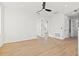 A spacious room with light hardwood floors, white walls, and natural light at 135 48Th Ave, St Petersburg, FL 33703