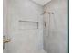 Modern shower with gray tile, dual shower heads, and a convenient built-in niche for toiletries at 135 48Th Ave, St Petersburg, FL 33703