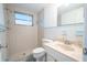 Clean bathroom with shower/tub combo and light blue accents at 3543 Seffner Dr, Holiday, FL 34691