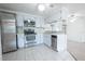 Kitchen with stainless steel appliances and white cabinets at 3543 Seffner Dr, Holiday, FL 34691