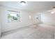 Spacious living room with neutral carpeting and ample natural light at 3543 Seffner Dr, Holiday, FL 34691
