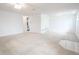 Open living room with carpeting, fireplace, and view into kitchen at 3543 Seffner Dr, Holiday, FL 34691
