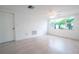 Spacious living room with tile flooring and large window at 3543 Seffner Dr, Holiday, FL 34691