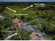 Aerial view of the house, conservation area and Tarpon Springs Golf Course at 957 Westwinds Blvd, Tarpon Springs, FL 34689