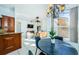 Kitchen and dining area with view into living room and access to patio at 957 Westwinds Blvd, Tarpon Springs, FL 34689