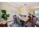 Formal dining room with hardwood floors and a view of the pool at 957 Westwinds Blvd, Tarpon Springs, FL 34689