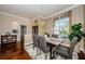 Spacious dining area with hardwood floors and large window at 957 Westwinds Blvd, Tarpon Springs, FL 34689