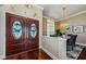 Elegant entryway with double doors and hardwood floors at 957 Westwinds Blvd, Tarpon Springs, FL 34689