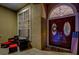 Covered entryway featuring a double door, seating and decorative elements at 957 Westwinds Blvd, Tarpon Springs, FL 34689