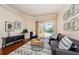 Gathering room with hardwood floors, a view of the pool area at 957 Westwinds Blvd, Tarpon Springs, FL 34689