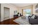 Cozy Gathering room with hardwood floors, sliding doors to pool at 957 Westwinds Blvd, Tarpon Springs, FL 34689