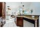 Open kitchen with granite island and views into living area at 957 Westwinds Blvd, Tarpon Springs, FL 34689