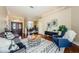 Relaxing living room with hardwood floors and comfy furniture at 957 Westwinds Blvd, Tarpon Springs, FL 34689