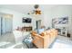 Spacious living area with ample natural light and stylish furnishings at 957 Westwinds Blvd, Tarpon Springs, FL 34689