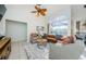 Relaxing living room with leather sofa and access to the backyard pool at 957 Westwinds Blvd, Tarpon Springs, FL 34689