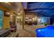 Entertain around a fire pit by the pool at 957 Westwinds Blvd, Tarpon Springs, FL 34689