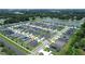 Aerial view of a residential neighborhood with houses and a lake at 102 Eagle Summit Dr, Ruskin, FL 33570