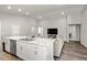 Open concept kitchen and living area, featuring a large island and modern appliances at 102 Eagle Summit Dr, Ruskin, FL 33570