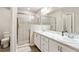 Modern bathroom with double vanity, large shower, and marble countertops at 102 Eagle Summit Dr, Ruskin, FL 33570