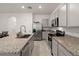 Modern kitchen with stainless steel appliances and granite countertops at 2926 Suncoast Plains Dr, Odessa, FL 33556