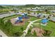 Community playground with slides, swings, and shade structures at 2926 Suncoast Plains Dr, Odessa, FL 33556