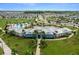 Community pool with clubhouse and plenty of lounge chairs at 2926 Suncoast Plains Dr, Odessa, FL 33556