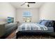 Bedroom with dark dresser, TV and large bed at 2926 Suncoast Plains Dr, Odessa, FL 33556
