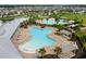 Aerial view of community pool and surrounding area at 2926 Suncoast Plains Dr, Odessa, FL 33556