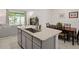 Island kitchen with granite countertops and stainless steel sink at 2926 Suncoast Plains Dr, Odessa, FL 33556