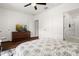 Bedroom with dresser, TV, and access to bathroom at 2926 Suncoast Plains Dr, Odessa, FL 33556