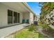 Small patio with grassy area and AC unit at 2926 Suncoast Plains Dr, Odessa, FL 33556