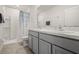 Bathroom with double vanity and walk-in shower at 2926 Suncoast Plains Dr, Odessa, FL 33556