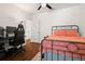 Bedroom with a metal bed frame and a workspace at 2926 Suncoast Plains Dr, Odessa, FL 33556