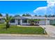 Charming ranch-style home with well-manicured lawn at 3543 Seffner Dr, Holiday, FL 34691