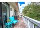 Private balcony with teal chair and small table at 2612 Pearce Dr # 306, Clearwater, FL 33764