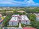 Aerial view highlighting condo building's location within a lush, tree-lined community at 2612 Pearce Dr # 306, Clearwater, FL 33764