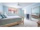 Bright bedroom with a queen bed and mirrored closet doors at 2612 Pearce Dr # 306, Clearwater, FL 33764