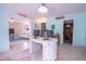 Bright home office with a large desk and dual monitors, near living room at 2612 Pearce Dr # 306, Clearwater, FL 33764