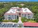 Aerial view showing condo building's location within a well-maintained community at 2612 Pearce Dr # 306, Clearwater, FL 33764