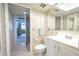 Clean bathroom with a white vanity, toilet, and shower at 2612 Pearce Dr # 306, Clearwater, FL 33764